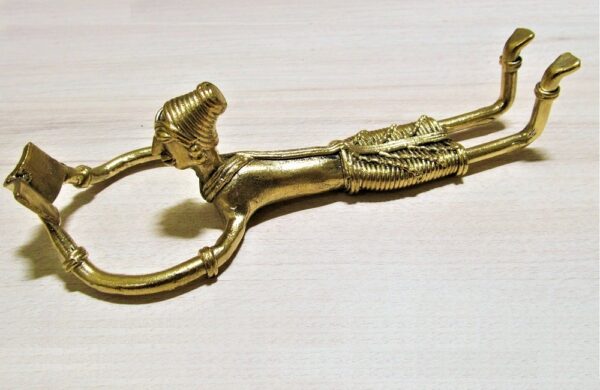 Collectible showpiece of handcrafted - dhokra metal figurine of lady lying and reading